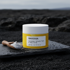 Close-up of Icelandic Volcano scrub texture, creamy formula with volcanic sand particles.